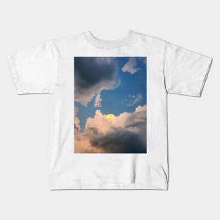 sunlit storm clouds Kids T-Shirt